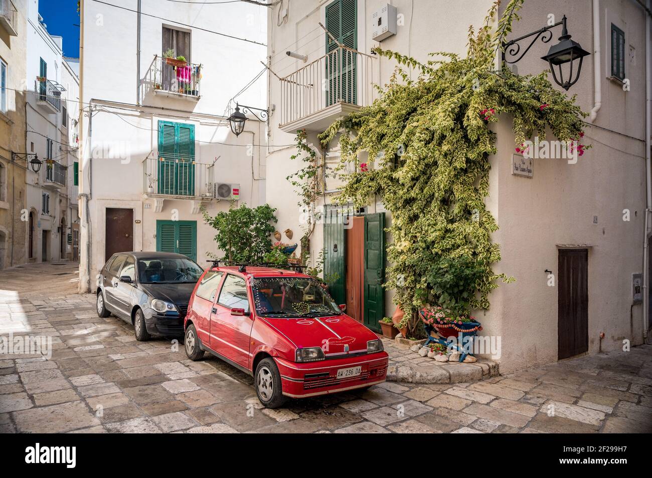cars in the oldtown of Monopoli in Puglia Stock Photo Alamy