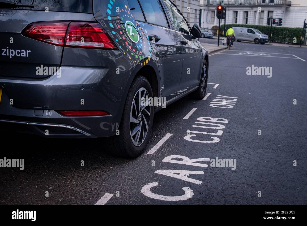London- March 2021: Zipcar car parking on street in Notting Hill- a car-sharing company and a subsidiary of Avis Budget Group Stock Photo