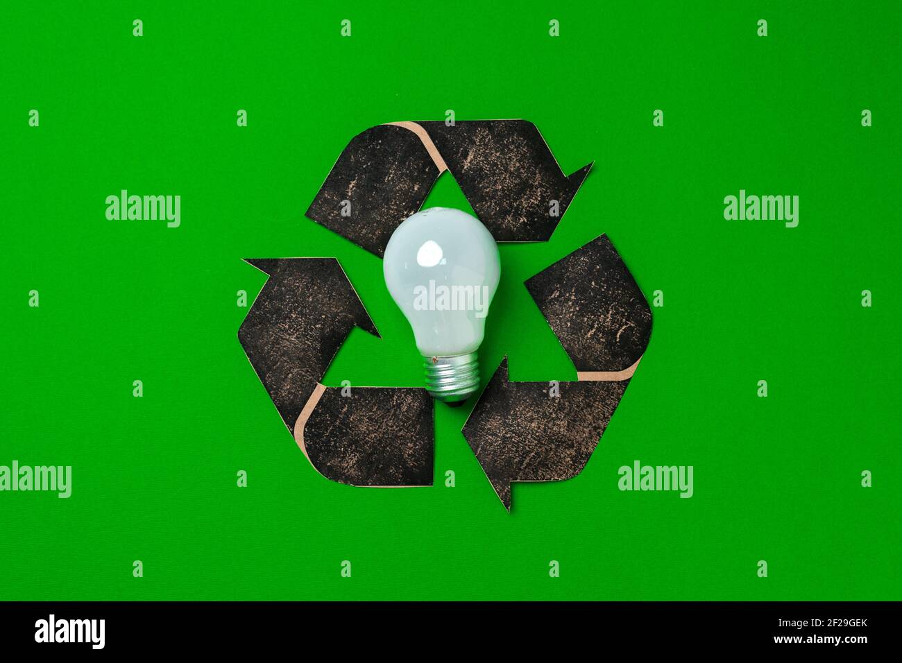 Light bulb and recycling sign on green background Stock Photo Alamy
