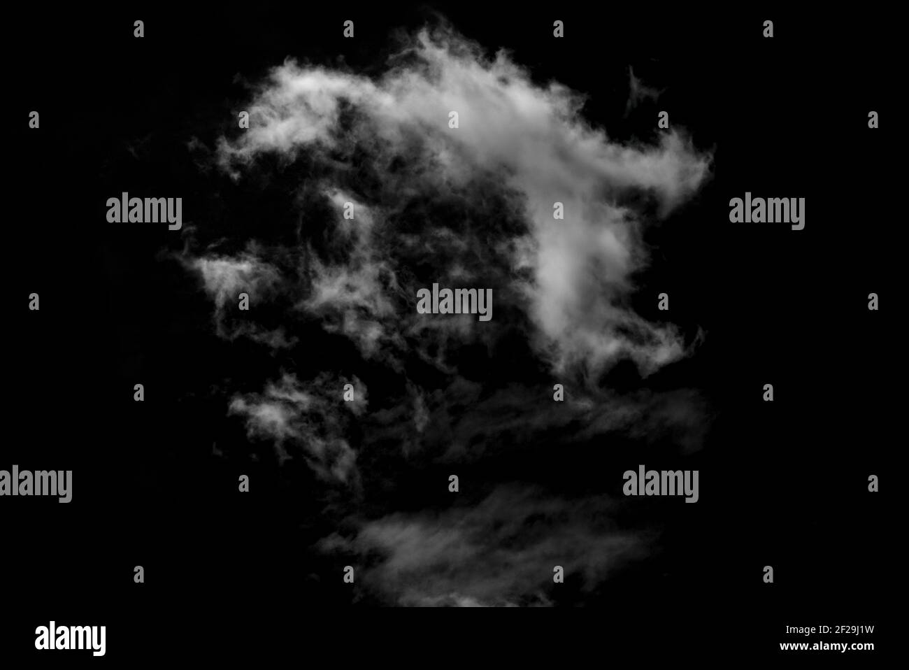 Isolated clouds on a plain black background. Stock Photo