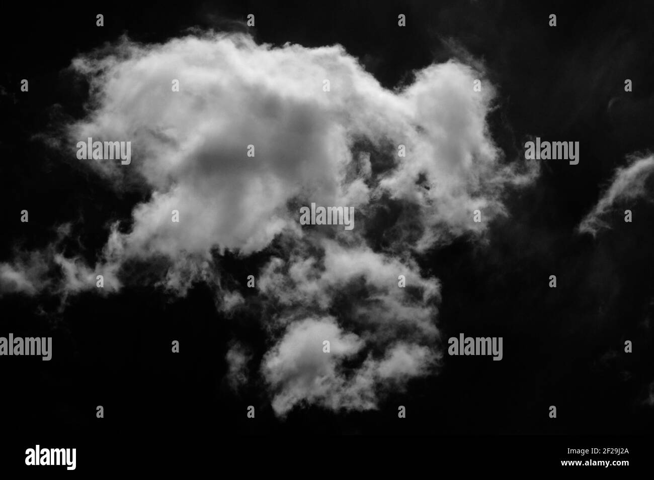 Isolated clouds on a plain black background. Stock Photo