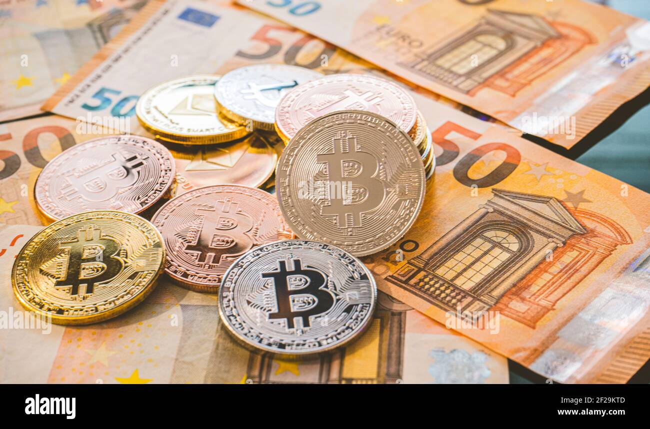 Bitcoin BTC coins on bills of euro banknotes. Worldwide virtual internet  cryptocurrency and digital payment system. Digital coin crypto money on  bitco Stock Photo - Alamy