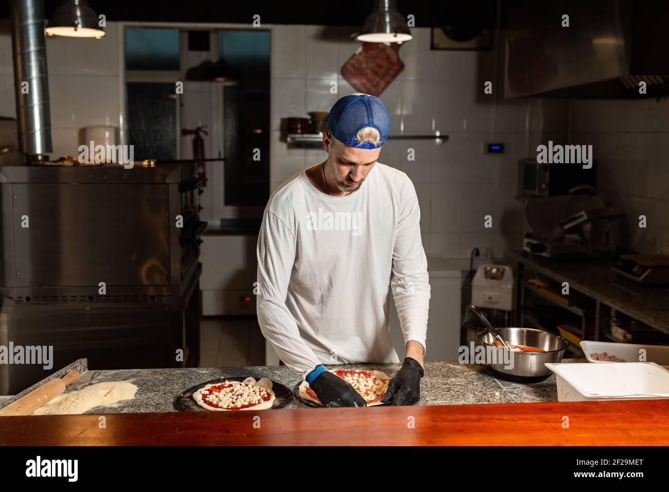 Chef prepares pepperoni pizza hi-res stock photography and images - Alamy