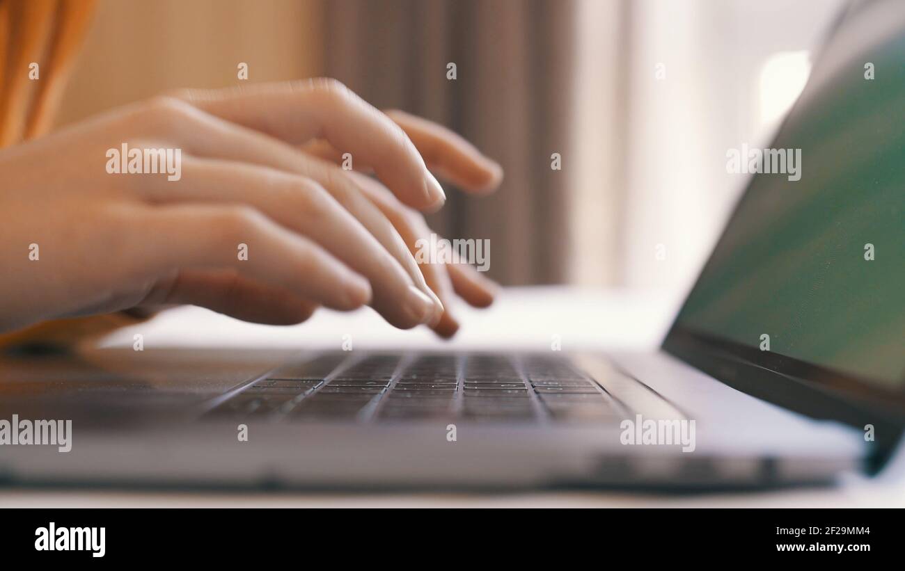 typing on laptop keyboard internet close-up work communication Stock