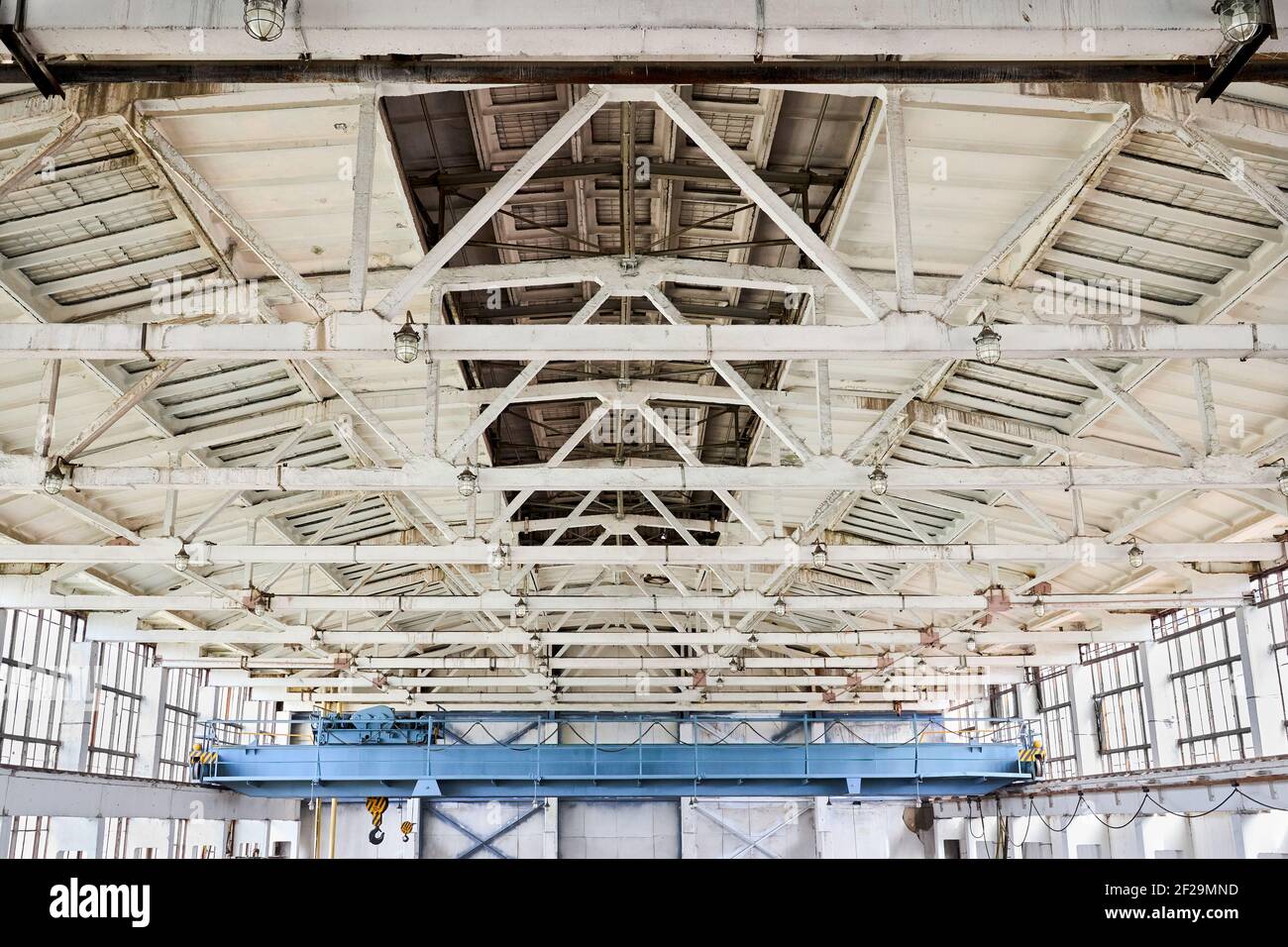 Overhead crane and concrete floor complex vaulted ceiling with