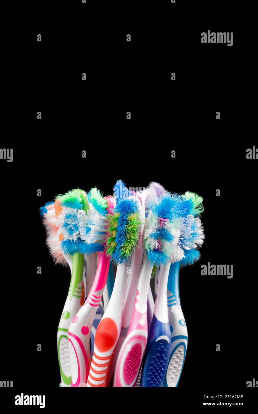 Used Toothbrushes Used toothbrush isolated on black background. Plastic health care ...
