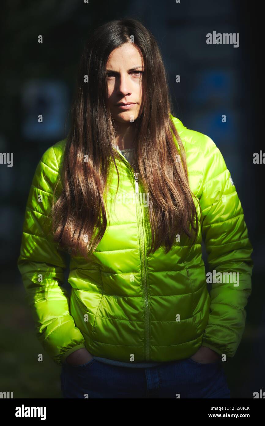 Portrait of a beautiful caucasian girl with long brown hair with green ...