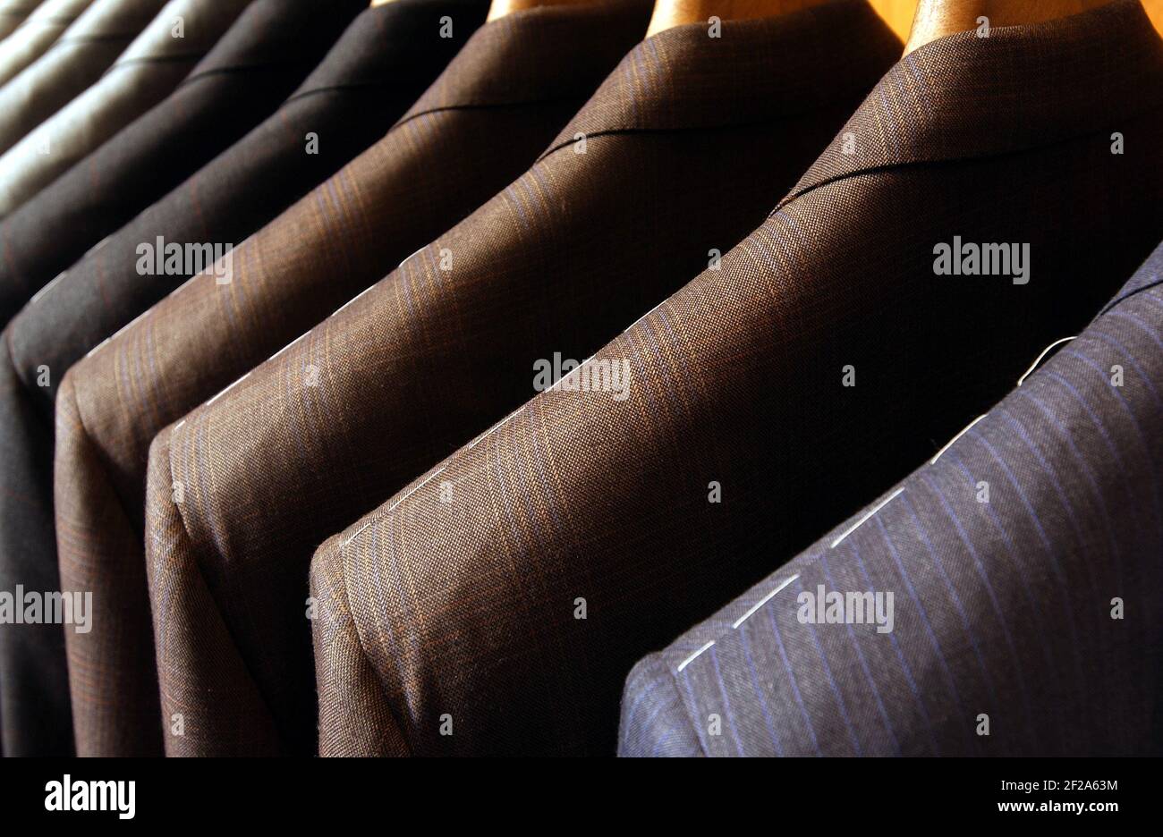 Close up of suit jackets for sale on a clothes rail Stock Photo
