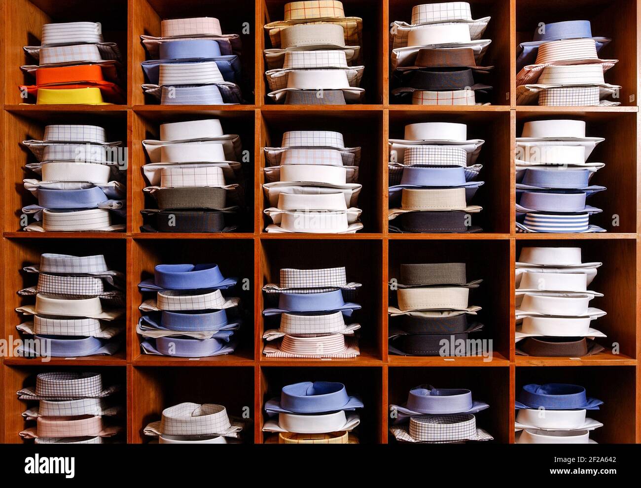 Close up of a shelf full of new mens business shirts in a retail store Stock Photo