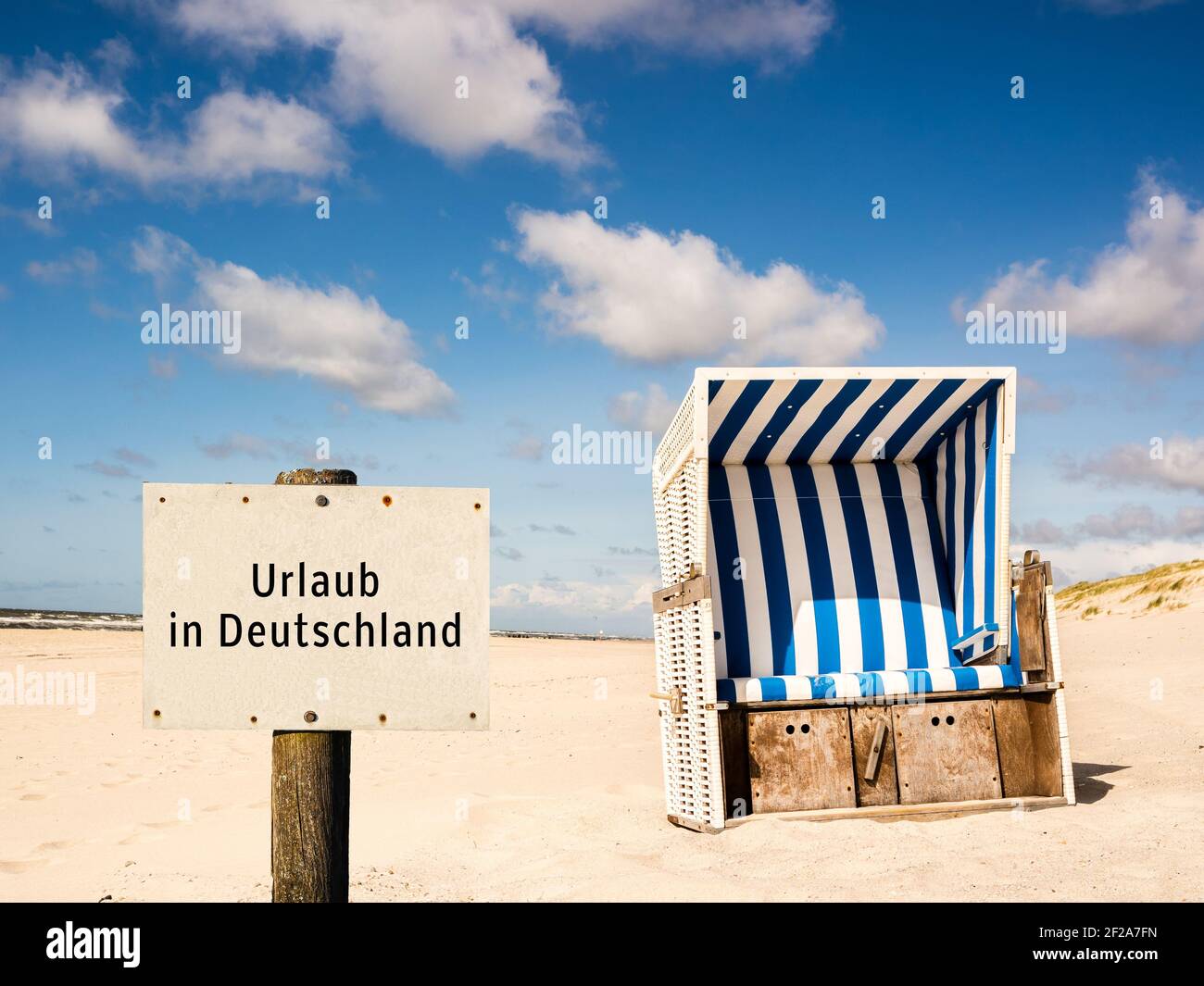 Beach chair with sign vacation in Germany Stock Photo