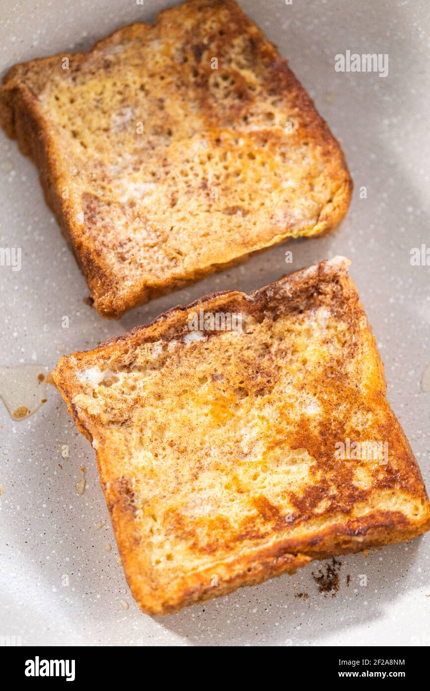 Frying french toast in a nonstick frying pan Stock Photo Alamy