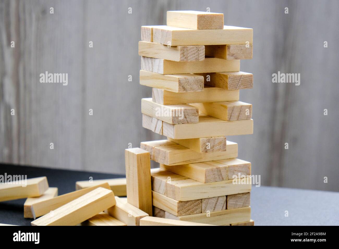 Building from wooden blocks - jenga. Wood blocks stack game with Hand ...