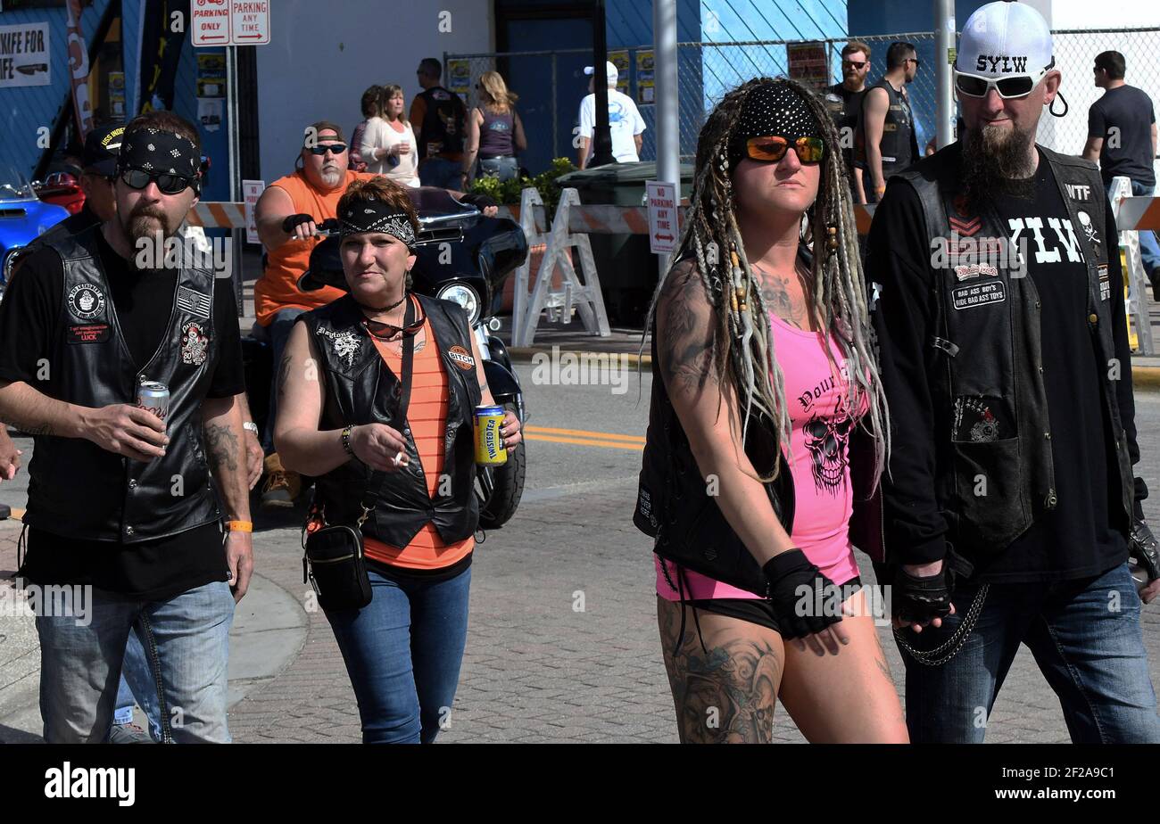 Motorcycle enthusiasts walk on Main Street during the 80th year of Daytona Beach's annual Bike Week event. Few people were seen wearing face masks or practicing social distancing and some worry the gathering could become a superspreader event as the coronavirus pandemic continues. (Photo by Paul Hennessy / SOPA Images/Sipa USA) Stock Photo