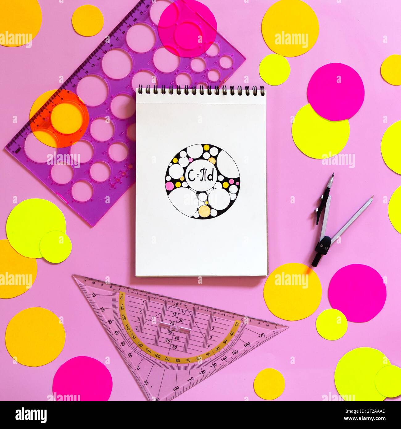 International Pi Day Happy Holiday Concept. Multicolored paper circles, school supplies and sketchbook with doodle zenart circle and circumference for Stock Photo