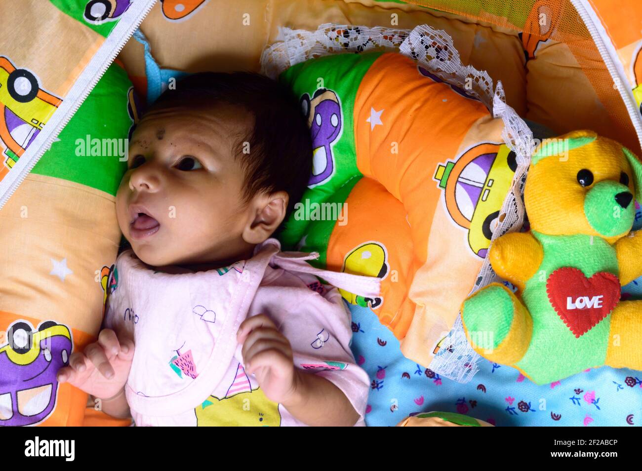 Indian girl sleeping in bed hi-res stock photography and images - Alamy