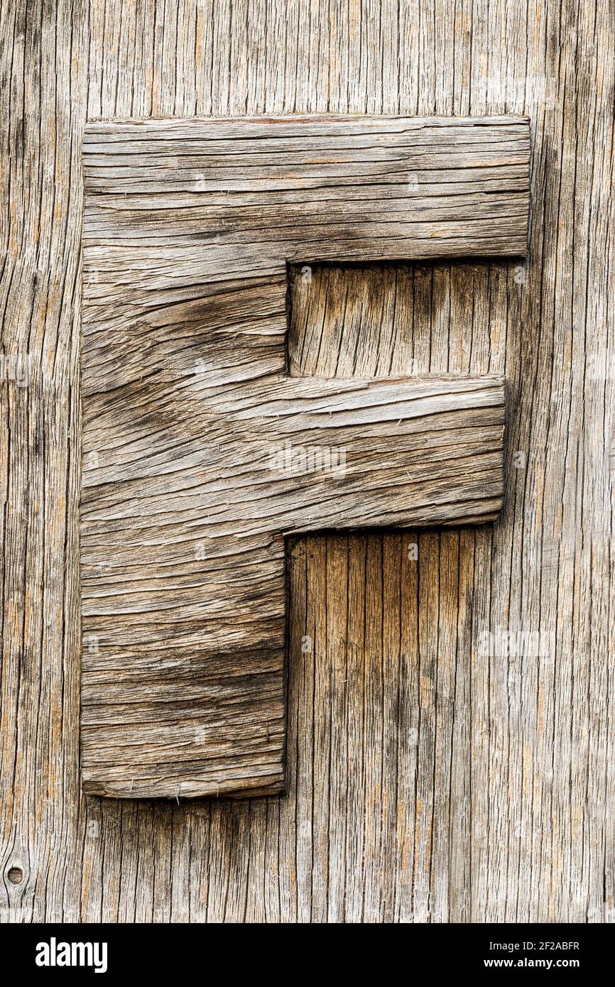 Letter F sawn from weathered wood Stock Photo