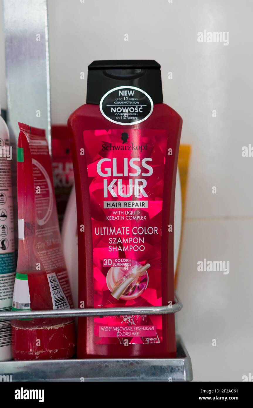 POZNAN, POLAND - Sep 03, 2017: Gliss Kur Hair Repair Ultimate Color shampoo in a plastic bottle on a small shower shelf Stock Photo