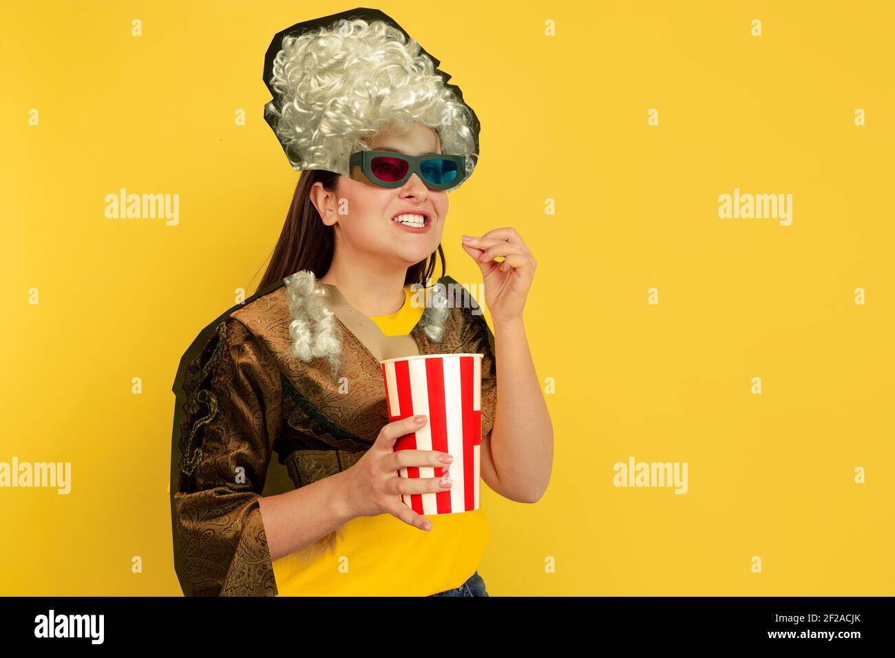 Cheering woman in movie. Magazine style collage with model outfit mixed of different eras. Copyspace for ad. Trendy colors, modern and vintage, renaissansse fashion. Cintemporary art collage. Stock Photo