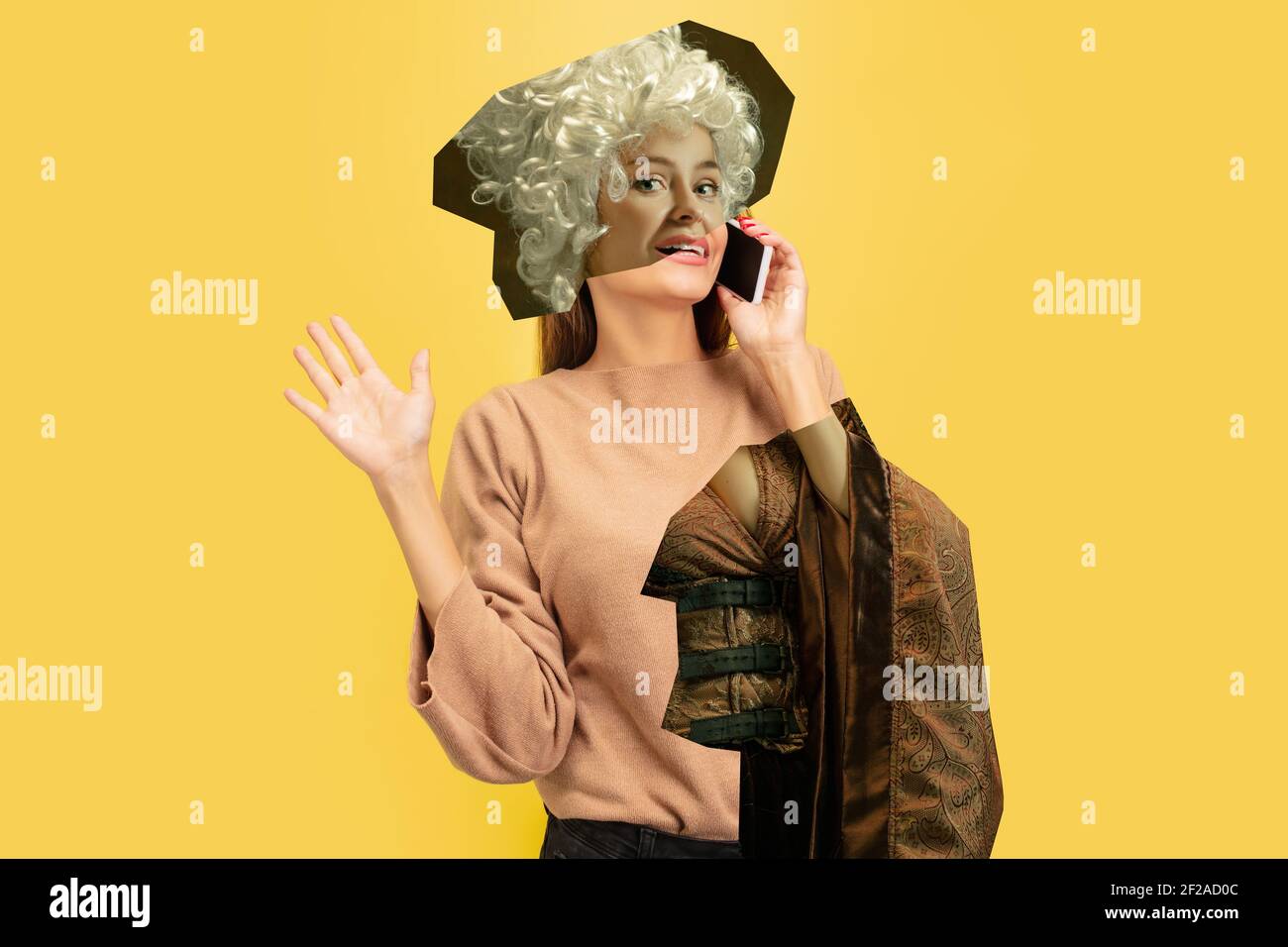 Woman talking phone. Magazine style collage with model outfit mixed of different eras. Copyspace for ad. Trendy colors, modern and vintage, renaissansse fashion. Cintemporary art collage. Stock Photo