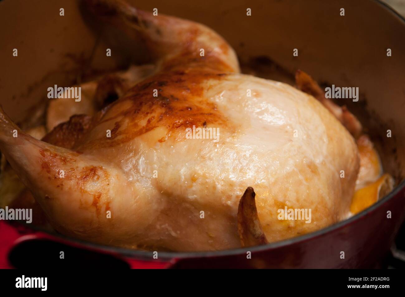 whole roasted chicken in lemongrass and coconut milk, crock pot Stock Photo Alamy