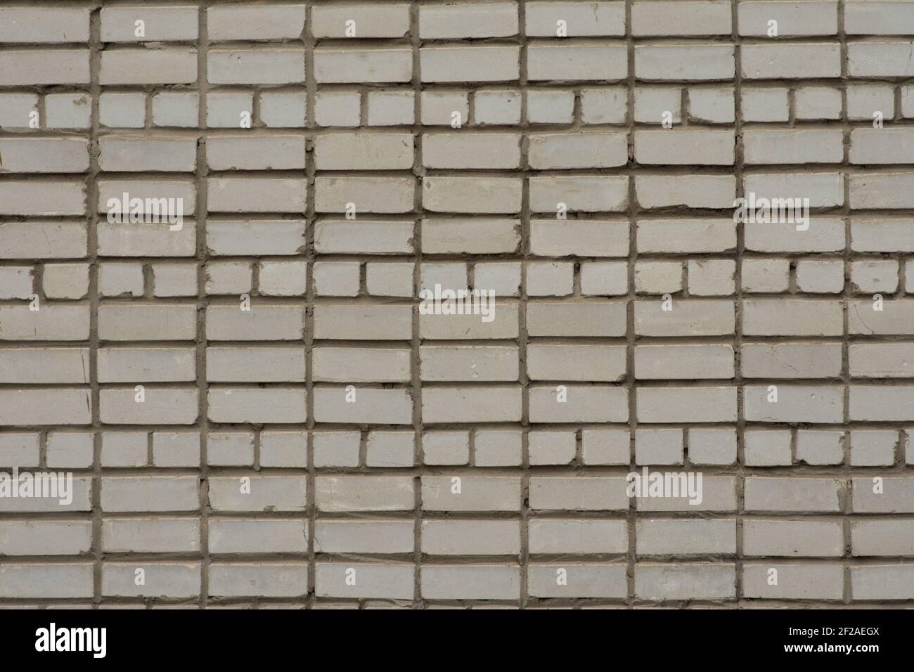 White brick wall. Part of the wall of a tall building. Stock Photo
