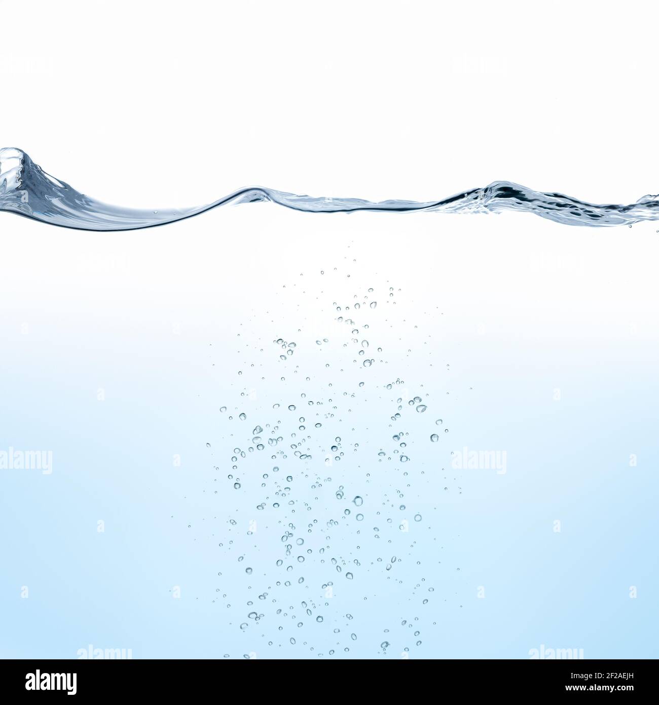 Rippling water and bubbles against blue background Stock Photo