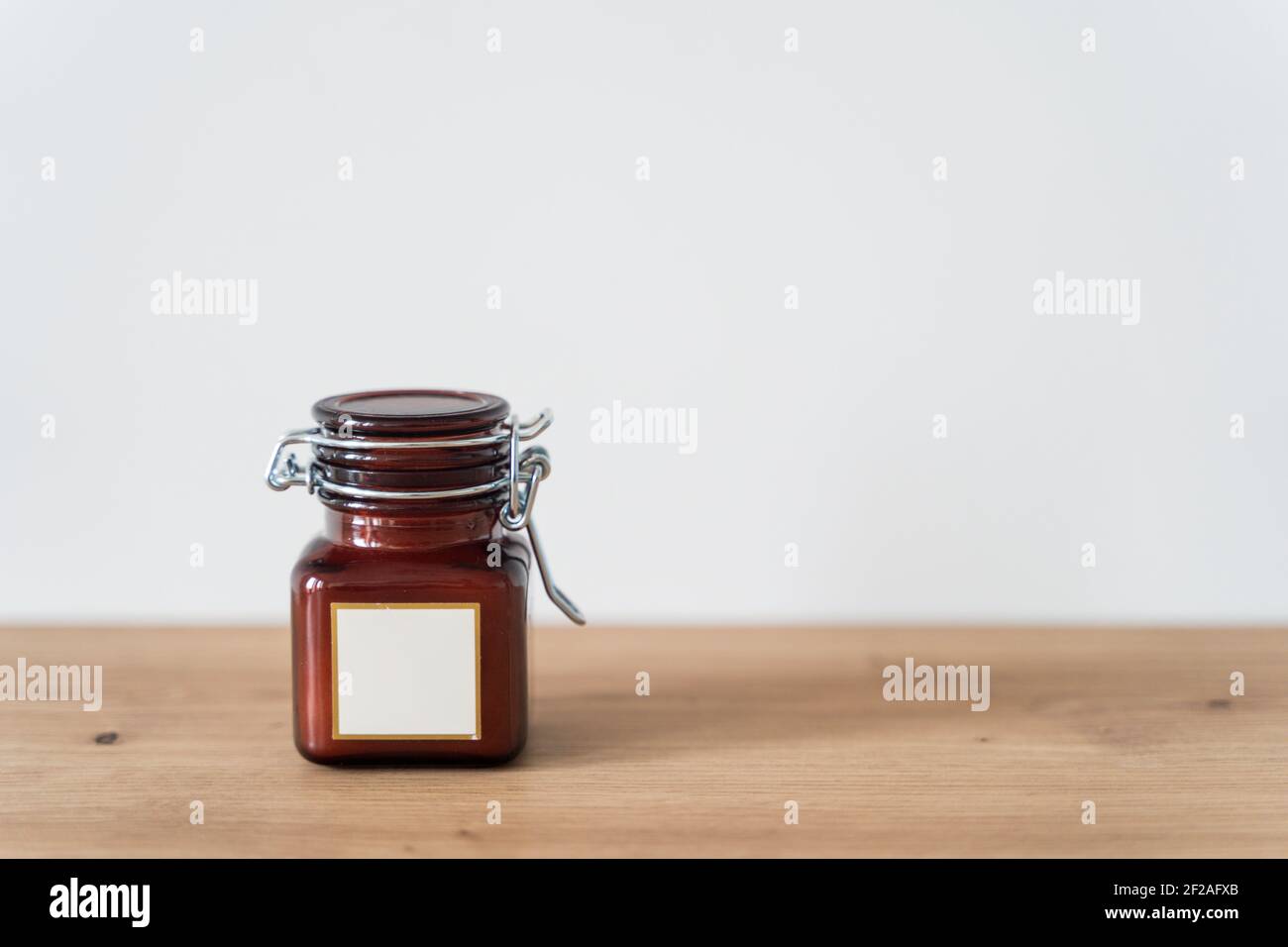 Scented candle in a glass jar on a white background Stock Photo Alamy