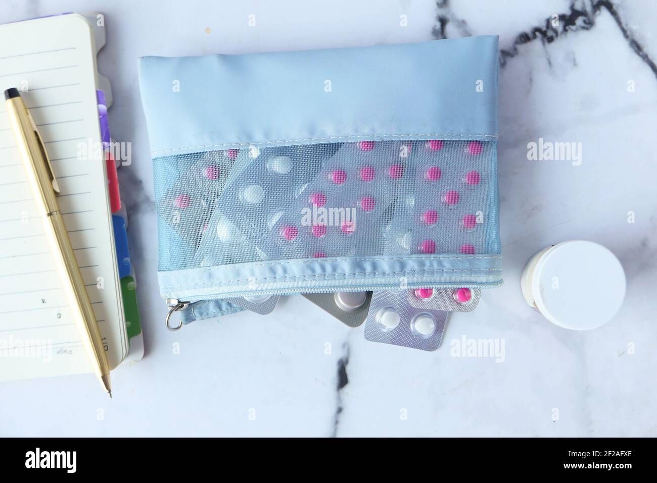 pills of blister pack in a small bag on white background Stock Photo