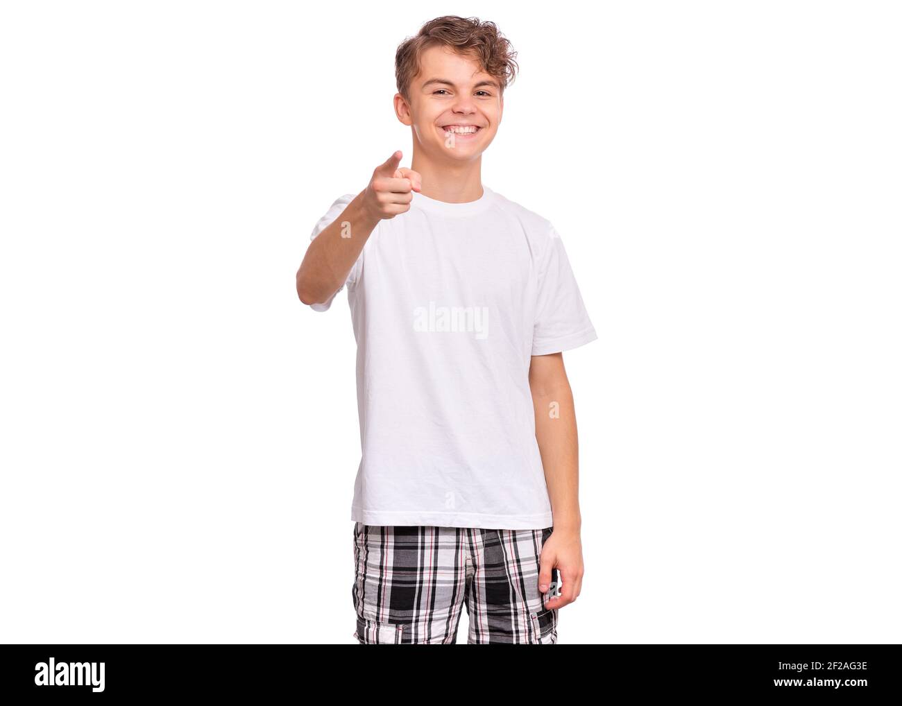 Handsome teen boy laughing looking very happy, isolated on white background Stock Photo