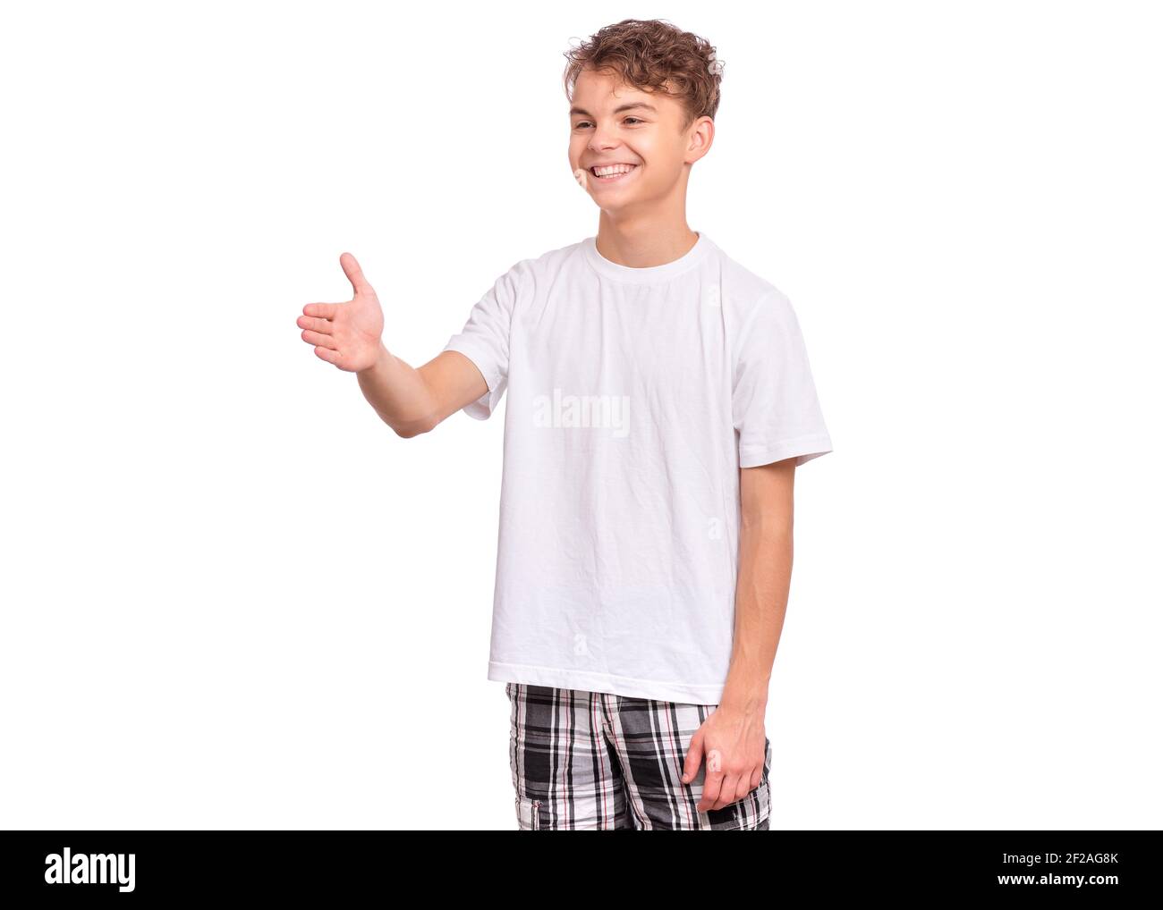 Handsome teen boy stretching his right hand up for greeting, isolated on white background Stock Photo