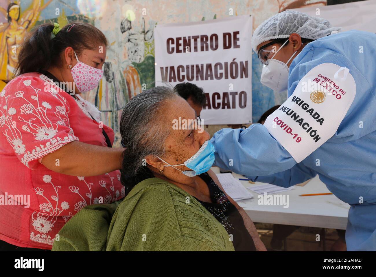 Uruapan, Mexico. 09th Mar, 2021. A person receives a dose of Pfizer-BioNTech Covid-19 vaccine, during mass vaccine inside of Hermanos Lopez Rayon sports center, a designated priority vaccination center for elderly over 60 years in the Uruapan town. On March 10, 2021 in Michoacan, Mexico (Photo by Eyepix/Sipa USA) Credit: Sipa USA/Alamy Live News Stock Photo