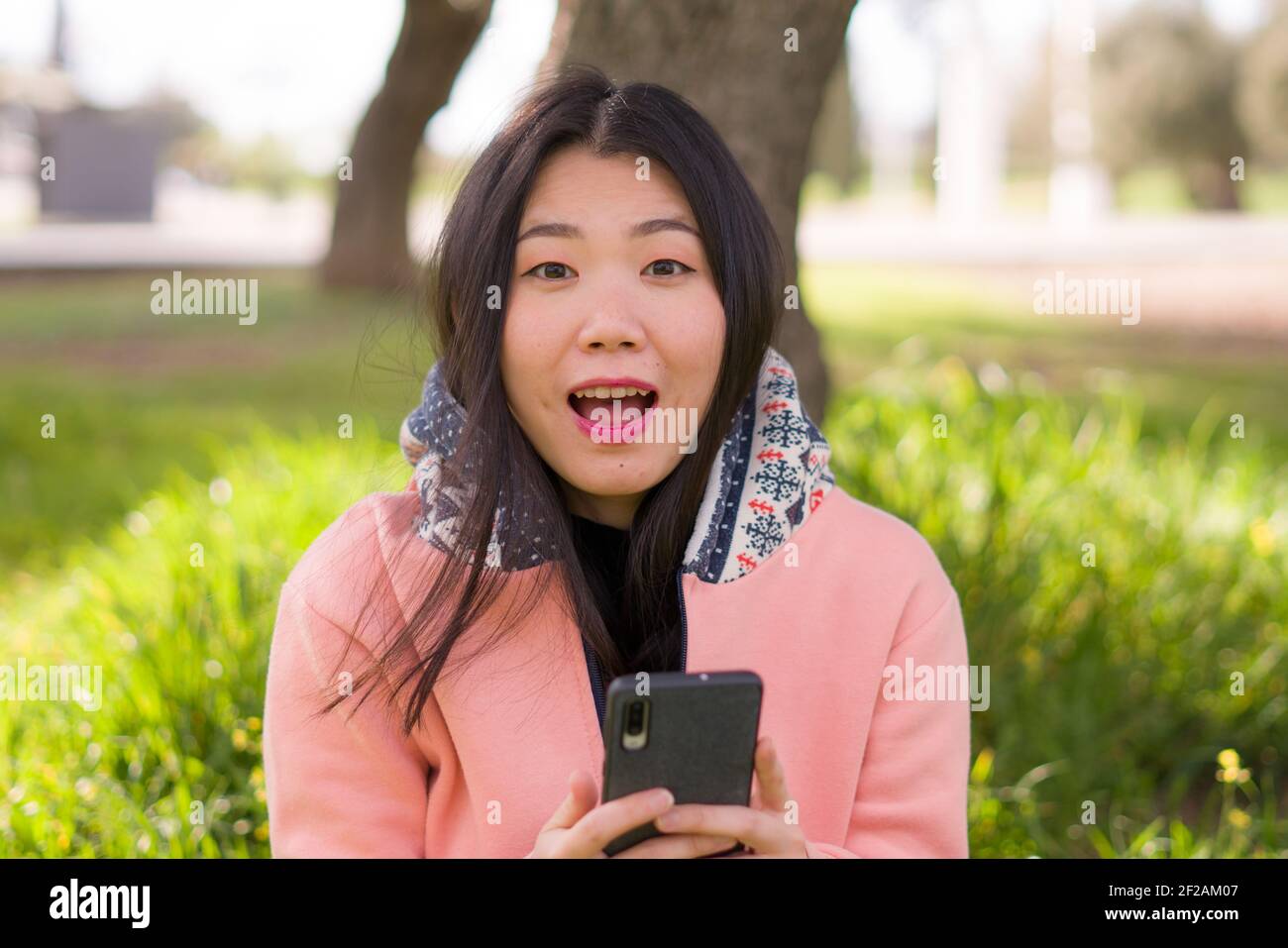 Happy Asian Woman Using Mobile Phone At City Park Young Sweet And Beautiful Chinese Girl Sitting On Green Grass Networking Enjoying Social Media Wit Stock Photo Alamy Happy Asian Woman Using Mobile Phone At City Park Young Sweet And Beautiful Chinese Girl Sitting On Green Grass Networking Enjoying Social Media Wit Stock Photo Alamy