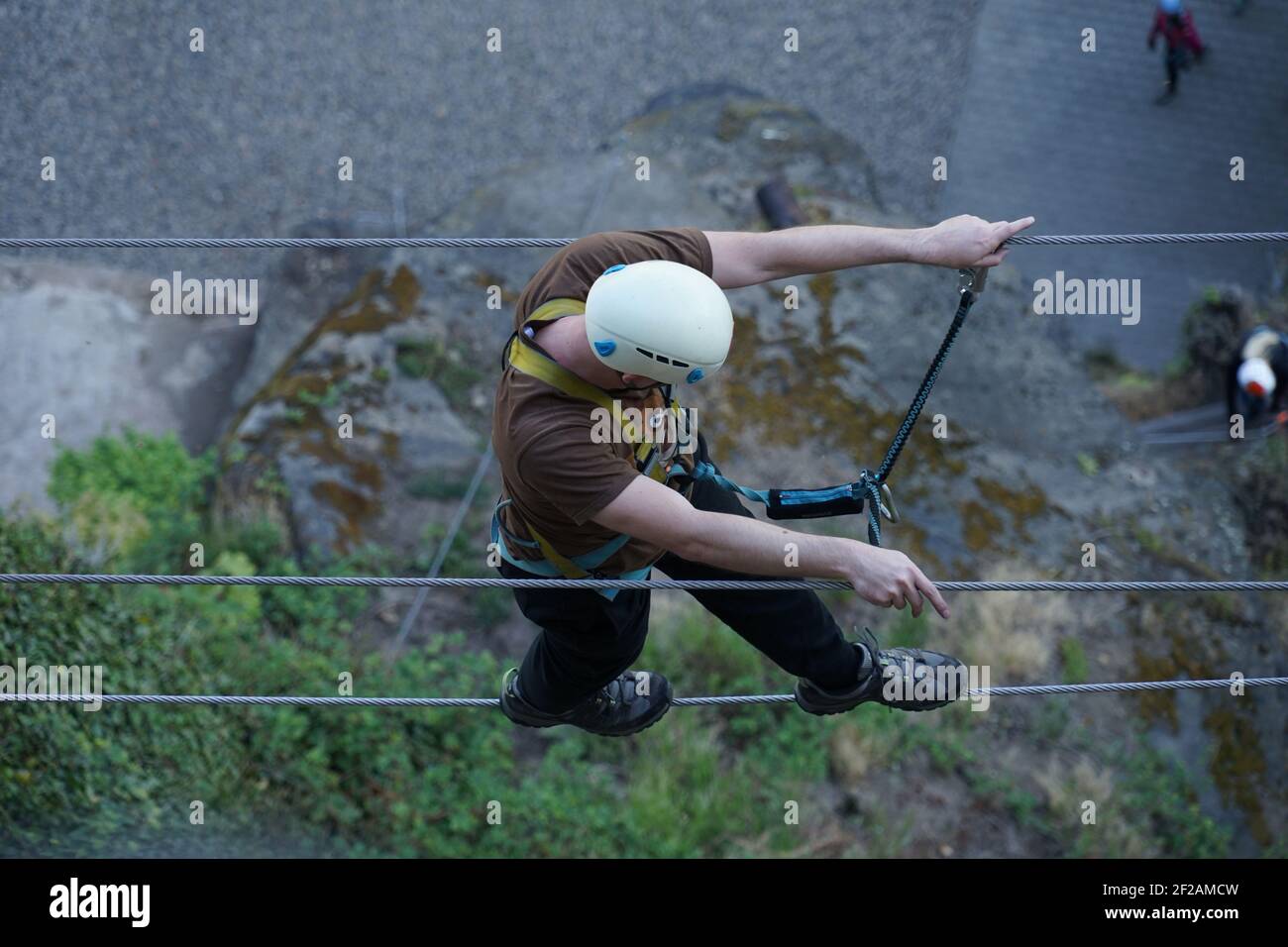 Single man climber walking on rope bridge at via ferrata mountain route  high above ground, Shepherd's Wall, Decin, Czech Republic Stock Photo -  Alamy