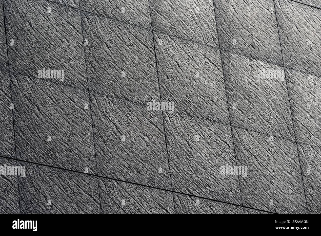 Black slate stone texture, selective focus. Stock Photo