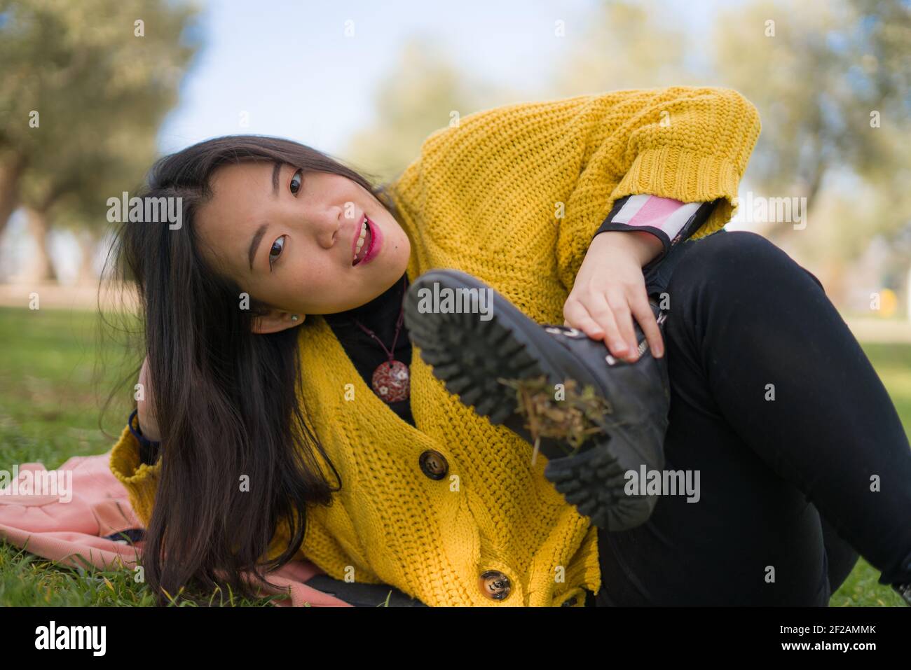 pretty Asian woman in city park - lifestyle portrait of young beautiful ...