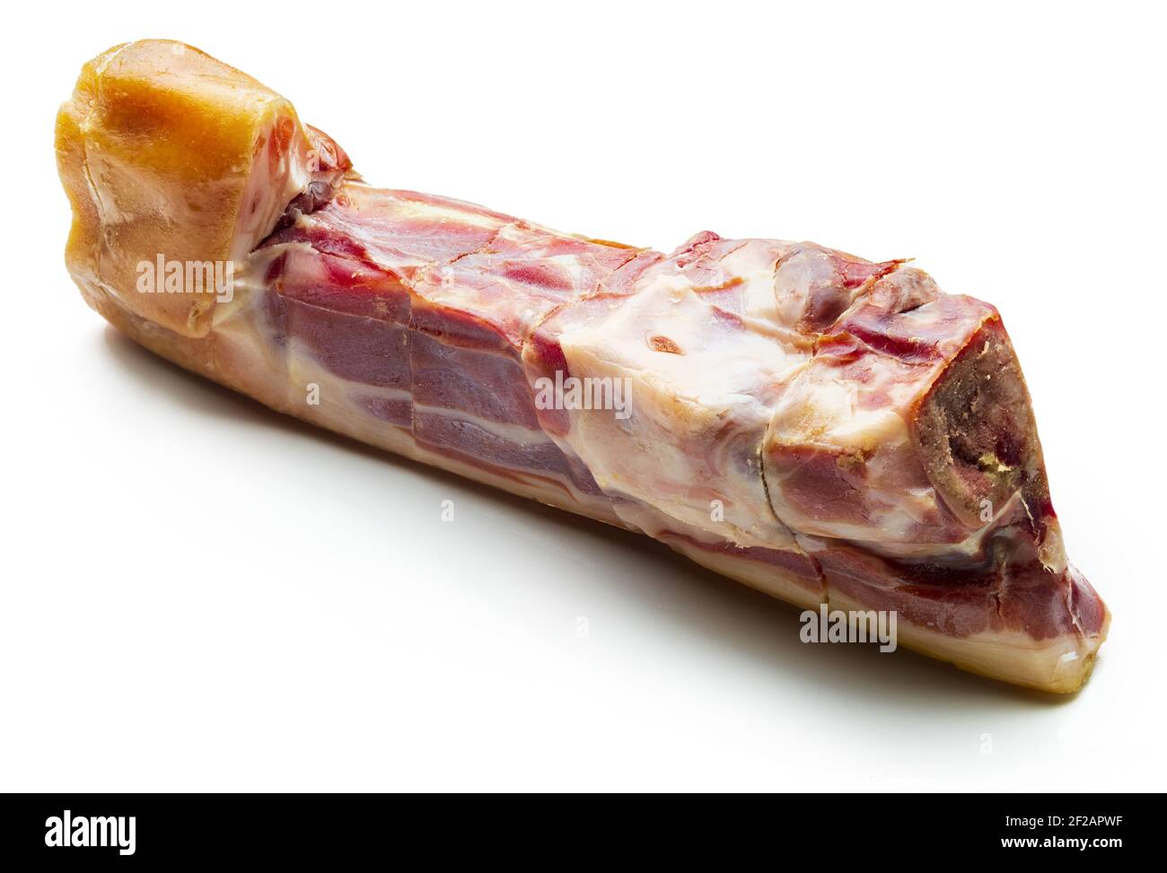 Whole knuckle (bone) of Iberian ham (serrano). Isolated on white background. Stock Photo