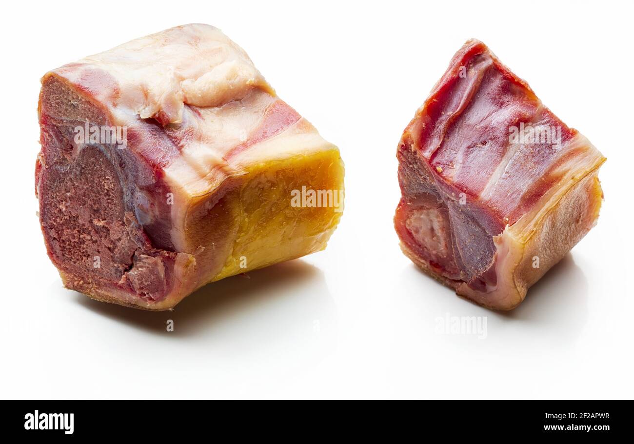 Pieces of knuckle (bone) whole of Iberian ham (serrano). Isolated on white background. Stock Photo