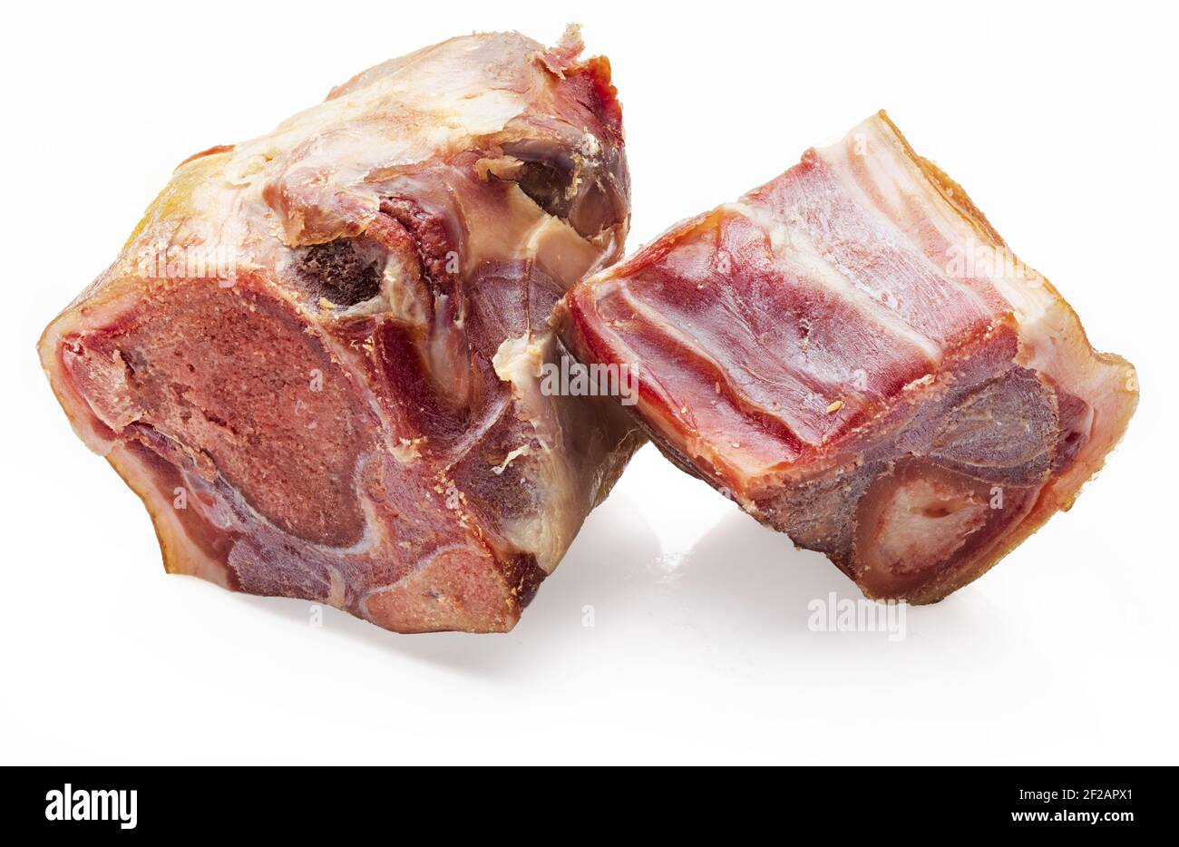 Pieces of knuckle (bone) whole of Iberian ham (serrano). Isolated on white background. Stock Photo