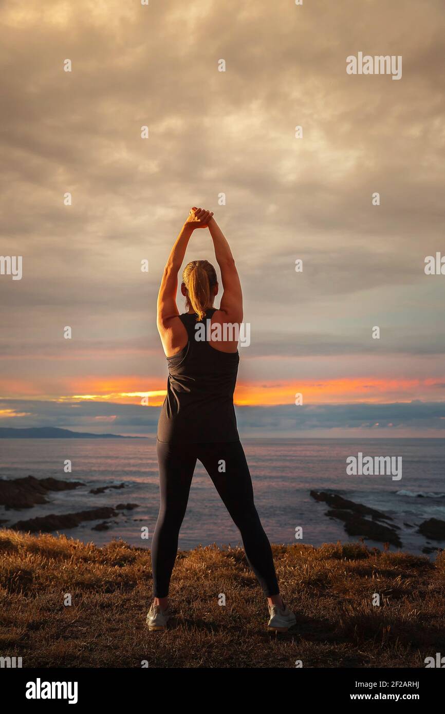 Fit blonde stretching back on hi-res stock photography and images - Alamy