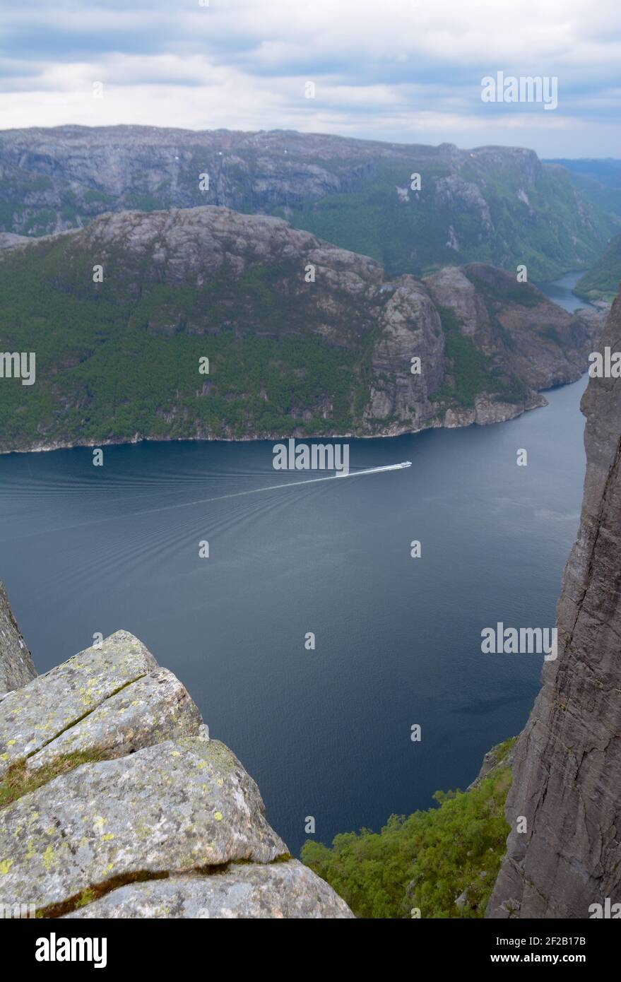 View of the Lysefjorden below and the surrounding mountains and landscape seen from the vantage point at Preikestolen in Stavanger, Norway. Stock Photo