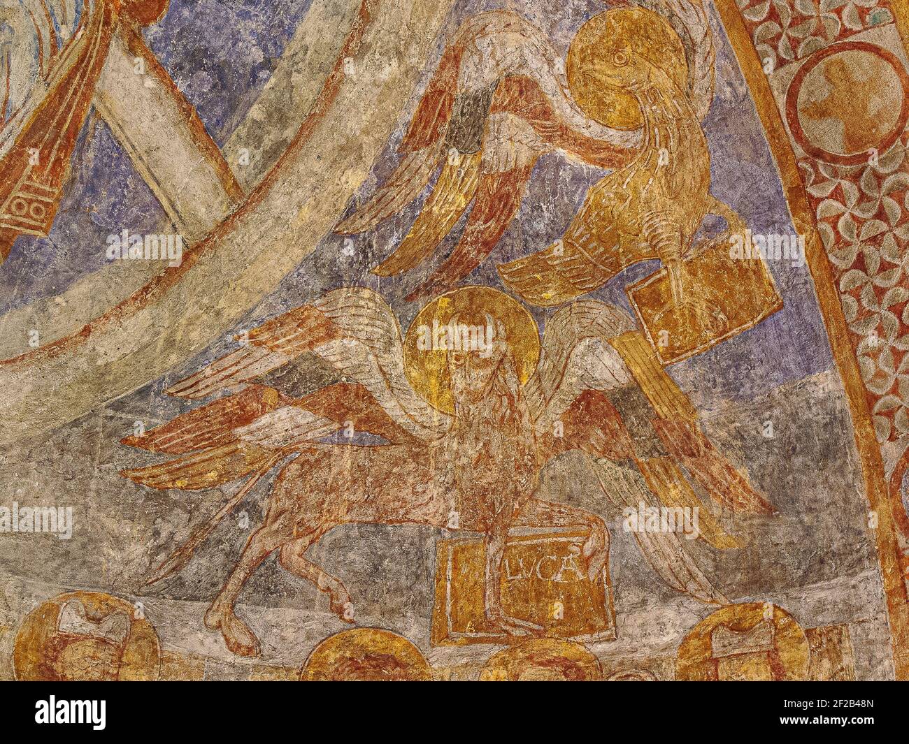 the eagle of St. John and the ox of St. Luke the Evangelist, an ancient romanesque painting in Övraby church, Sweden, November 6, 2009 Stock Photo