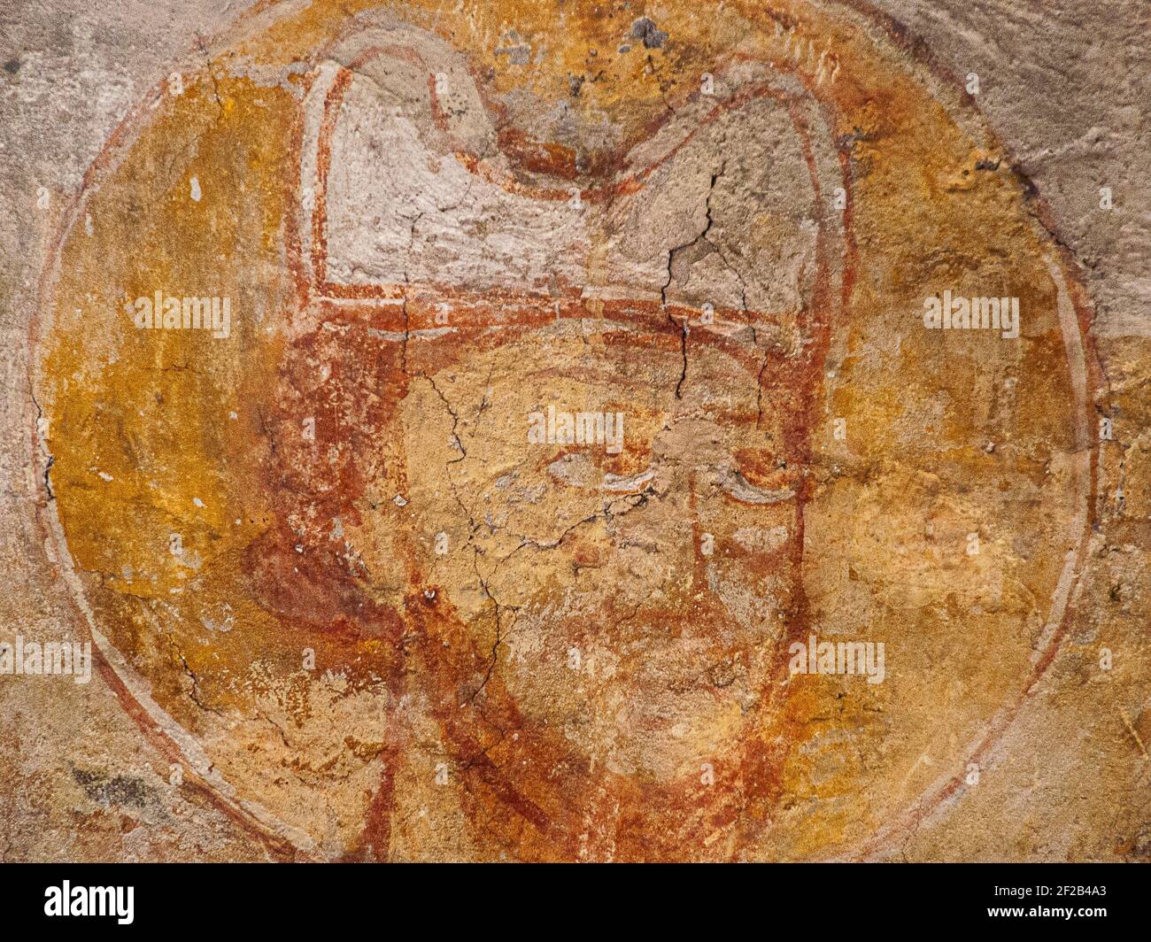 a bishop´s mitre with two horns, a romanesque wall-painting from the 1100s in Övraby church, Sweden, November 6, 2009 Stock Photo