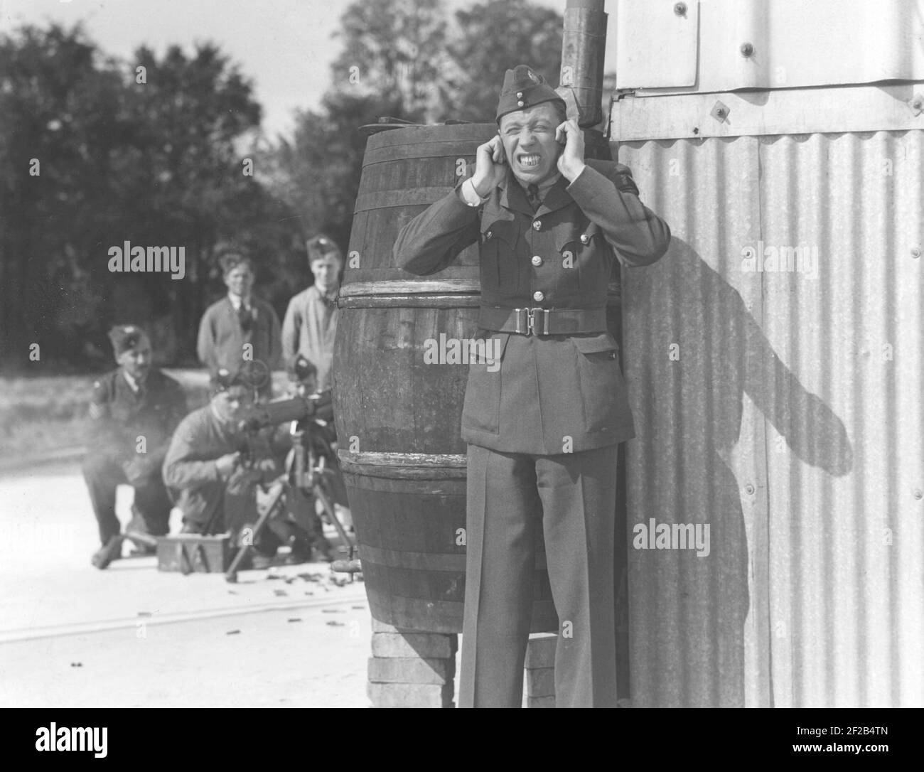 George Formby. British singer, actor known as the ukulele man. 1904-1961. He was the the highest paid british actor 1940. Pictured while playing a role in a film Stock Photo