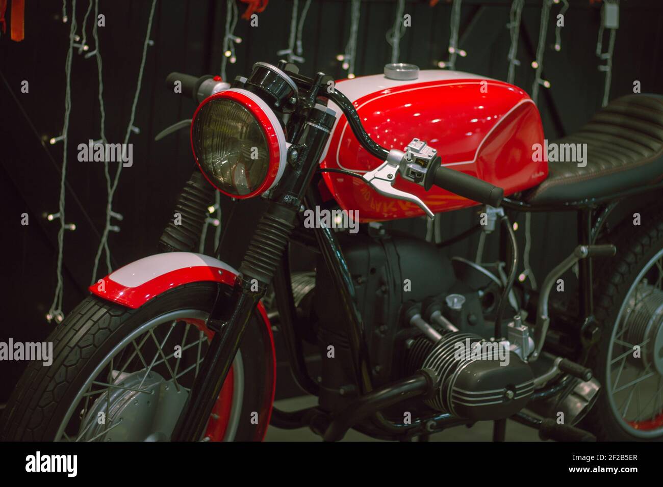Red classic style motorcycle, with black frame and steering wheel Stock Photo