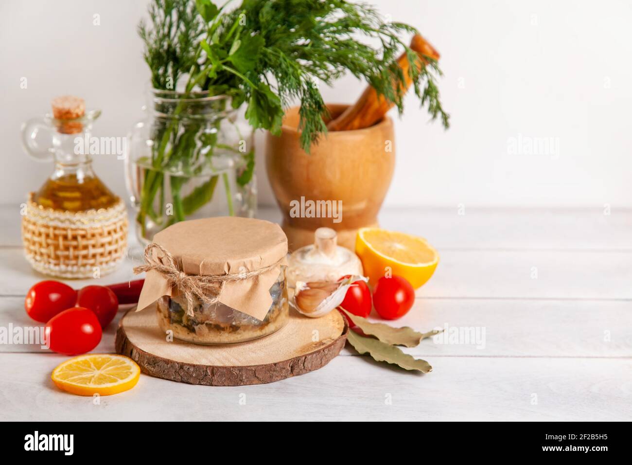 Homemade canned fish from mackerel in oil. Glass jars with canned fish. Stock Photo
