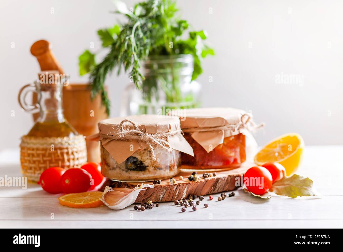 Homemade canned fish from mackerel in oil and tomato paste. Glass jars