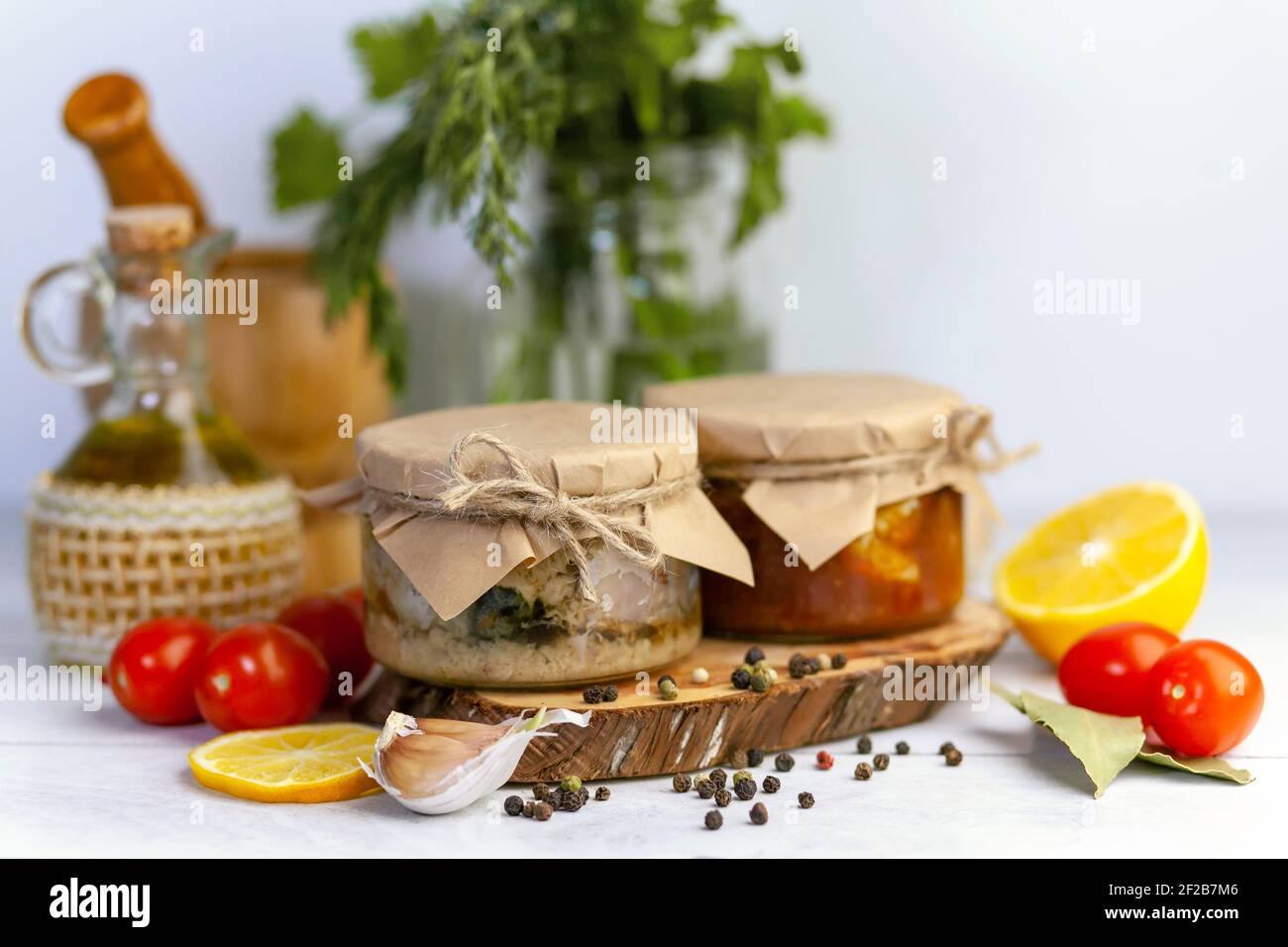 Homemade canned fish from mackerel in oil and tomato paste. Glass jars