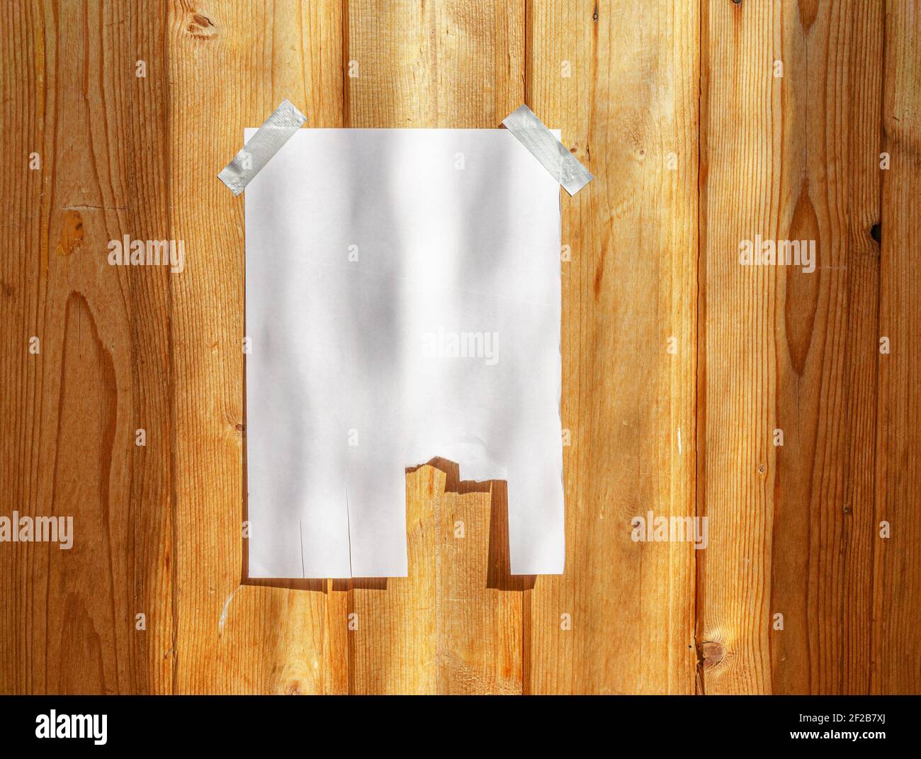 off paper on wood wall. Mock up template. Street paper ad or announcement with tear-off stripes with phone number. Blank mockup Stock Photo - Alamy