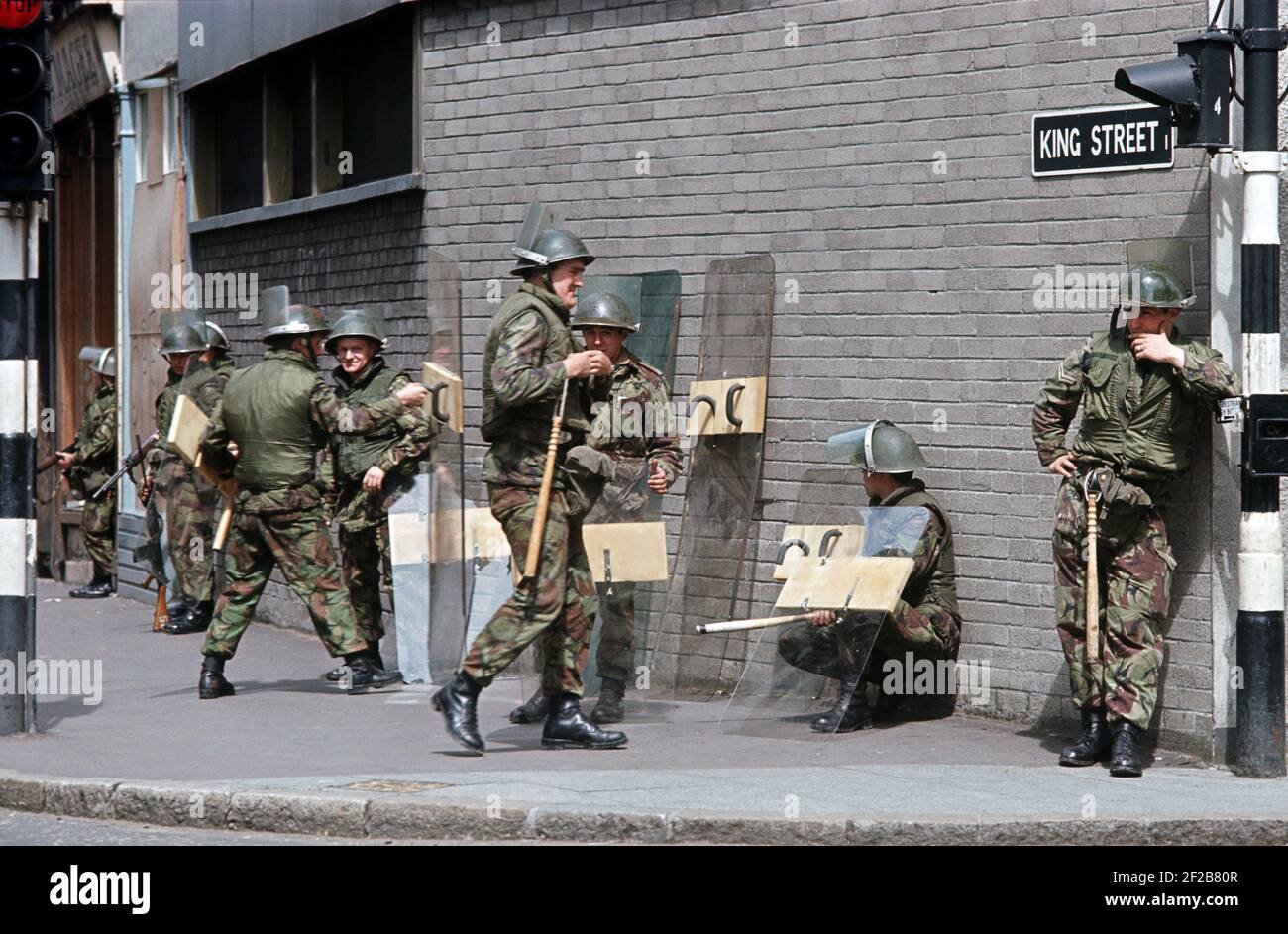 BELFAST, UNITED KINGDOM - MAY 1972. British Army Troops with Anti Riot Gear in City Center of Belfast during The Troubles, Northern Ireland, 1970s Stock Photo