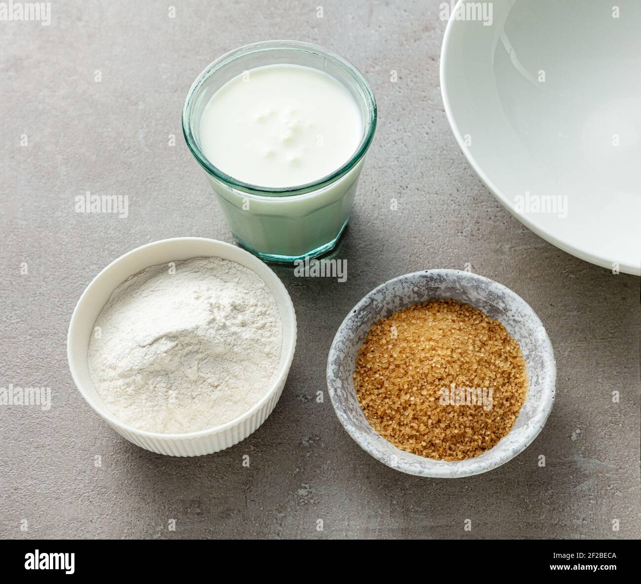 various baking ingredients on grey kitchen table, top view Stock Photo